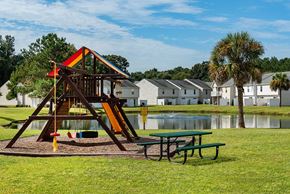 Charleston apartment for rent - A playground with a slide and a picnic table at The Islands in Charleston SC