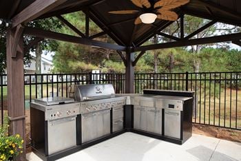 Swimming pool with outdoor grill