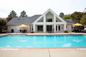 Swimming pool with outdoor grill