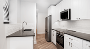 Washington apartment for rent - a kitchen with white cabinets and stainless steel appliances