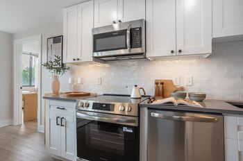 Galley style kitchen with walls of cabinets