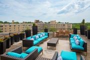 Washington apartment for rent - A patio with blue cushions and furniture.