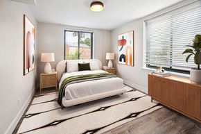 Hyattsville apartment for rent - a bedroom with a bed and two windows