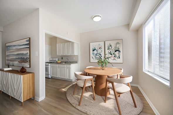 Washington apartment for rent - A dining room with a round table and chairs.