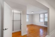 Washington apartment for rent - A room with wooden floors and white walls.