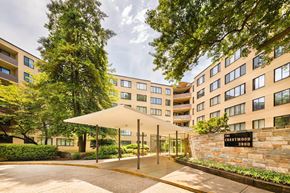 Washington apartment for rent - The entrance to a building with a stone wall and a sign that reads "The Chestwood 3000".