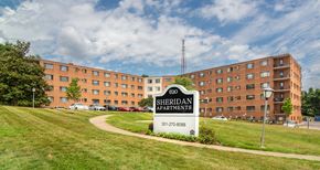 Hyattsville apartment for rent - a large building with a sign in front of it