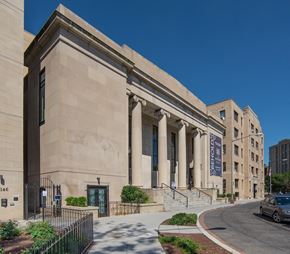 Washington apartment for rent - a large building with columns and a street in front of it