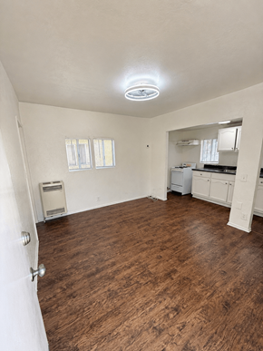 Signal Hill apartment for rent - A room with a wood floor and a ceiling fan.