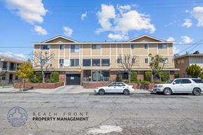 Hawthorne apartment for rent - A building with the words "Beach Front Property Management" on a sign in front of it.