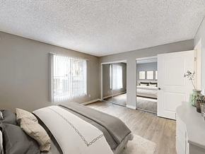 Paramount apartment for rent - A bedroom with a large bed and a dresser.