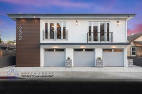 Huntington Beach apartment for rent - a rendering of a house with two garage doors and a sidewalk
