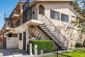 Hawthorne apartment for rent - A building with a staircase leading to the second floor.
