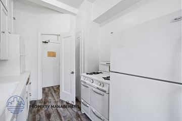 Los Angeles apartment for rent - a white kitchen with white appliances and a white refrigerator