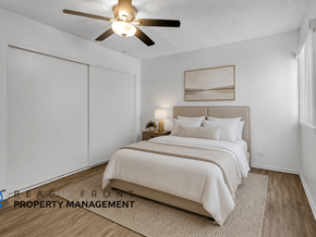 El Monte apartment for rent - A bedroom with a bed, a ceiling fan, and a painting on the wall.
