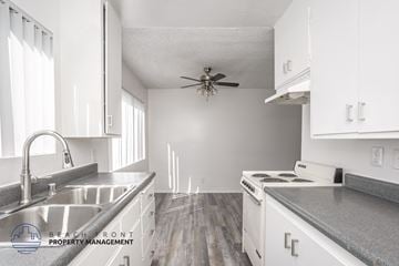 Torrance apartment for rent - A kitchen with white cabinets and a stainless steel sink.