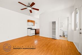 Long Beach apartment for rent - a empty room with a ceiling fan and a light
