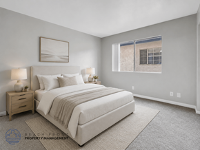 Long Beach apartment for rent - A well-lit bedroom with a large bed and a window.
