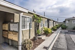 Downey apartment for rent - A row of houses with a sign that says