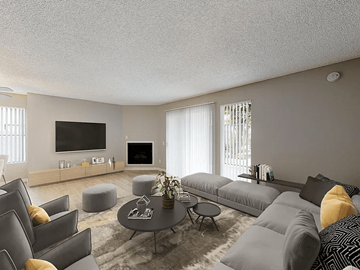 Paramount apartment for rent - A modern living room with grey couches and a coffee table.