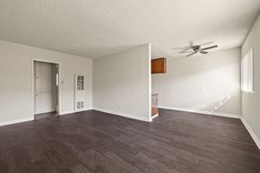 Inglewood apartment for rent - A room with a ceiling fan and a brown floor.