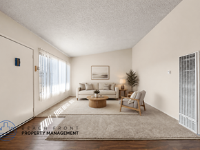 Gardena apartment for rent - A living room with a couch, chair, and a rug.