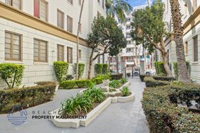 Los Angeles apartment for rent - A well-maintained garden pathway with a variety of plants and trees.