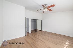 Hawthorne apartment for rent - A room with a ceiling fan and wooden flooring.