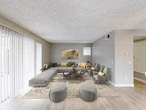 Paramount apartment for rent - A living room with a grey couch and a coffee table.