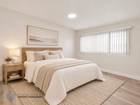 Inglewood apartment for rent - A bedroom with a large bed and a painting on the wall.