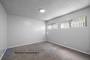 Inglewood apartment for rent - the living room of a house with white walls and carpet