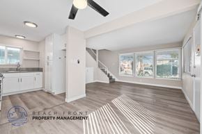 Redondo Beach apartment for rent - A spacious living room with a staircase leading to the upper floor.