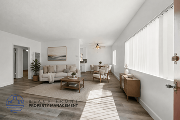 Inglewood apartment for rent - A living room with a couch, chair, and a painting on the wall.