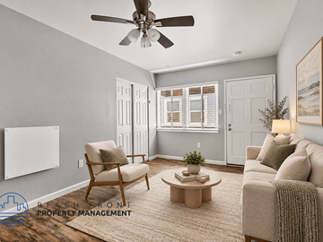 Long Beach apartment for rent - A living room with a ceiling fan, a chair, a coffee table, and a couch.