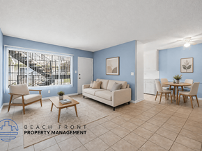 Gardena apartment for rent - A living room with a couch, chairs, and a dining table.
