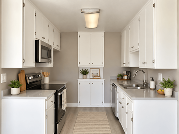 Redondo Beach apartment for rent - A kitchen with white cabinets and appliances.