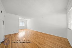 Inglewood apartment for rent - the living room and dining room with wood floors and white walls