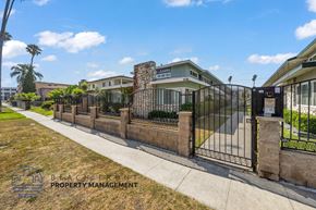 Inglewood apartment for rent - a gate with a fence in front of a building