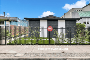 Venice apartment for rent - a gate with a red sign on it in front of a house
