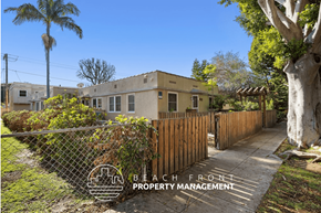 Santa Monica apartment for rent - a house with a fence and a sidewalk in front of it