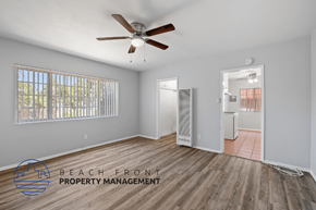 Long Beach apartment for rent - a living room with wood flooring and a ceiling fan