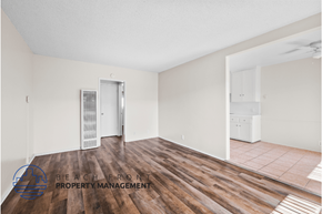 Gardena apartment for rent - a renovated living room with wood floors and white walls