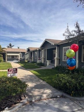 Anaheim apartment for rent - A house is for rent with a sign in front of it.