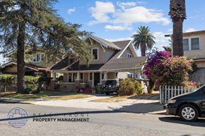 Los Angeles apartment for rent - a row of houses on a street with a car parked in front
