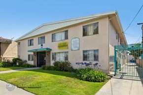 Inglewood apartment for rent - A building with a green gate in front of it.