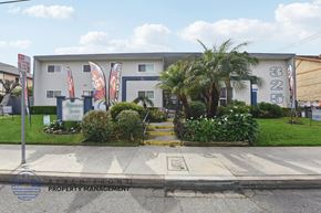 Alhambra apartment for rent - A white building with a butterfly sign on the front.