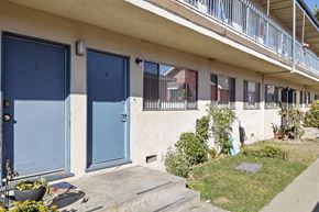 Inglewood apartment for rent - A building with blue doors numbered 4 and 5.