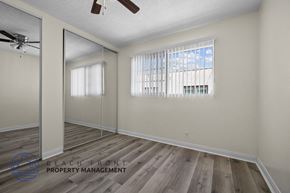 Long Beach apartment for rent - the living room of an apartment with wood flooring and a mirrored closet