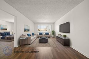 Gardena apartment for rent - A living room with a flat screen TV mounted on the wall.