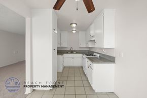 Inglewood apartment for rent - A kitchen with white cabinets and a tile floor.